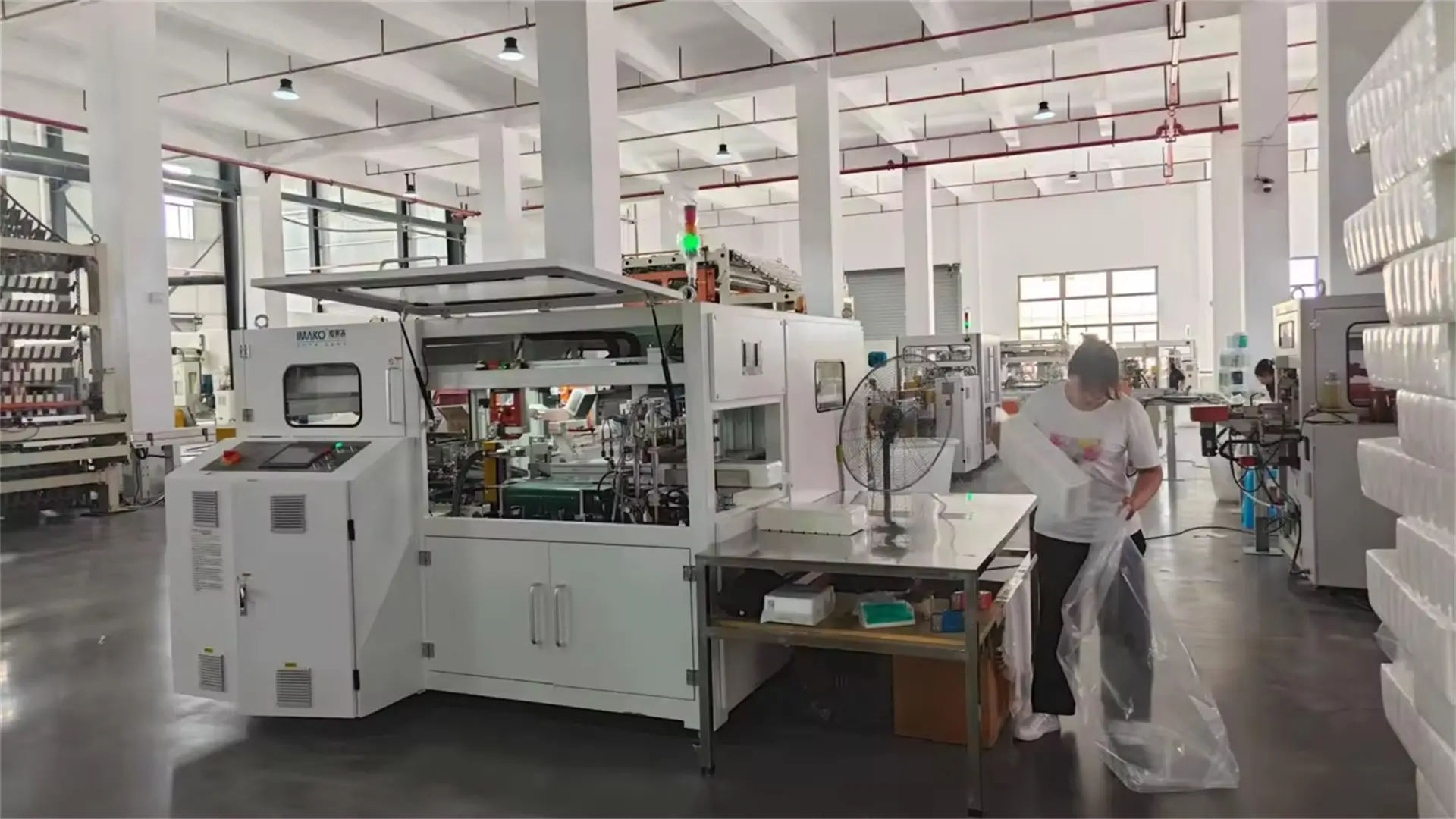 Bamboo tissue rolls being packed for shipment in step 8 of the bamboo tissue manufacturing process